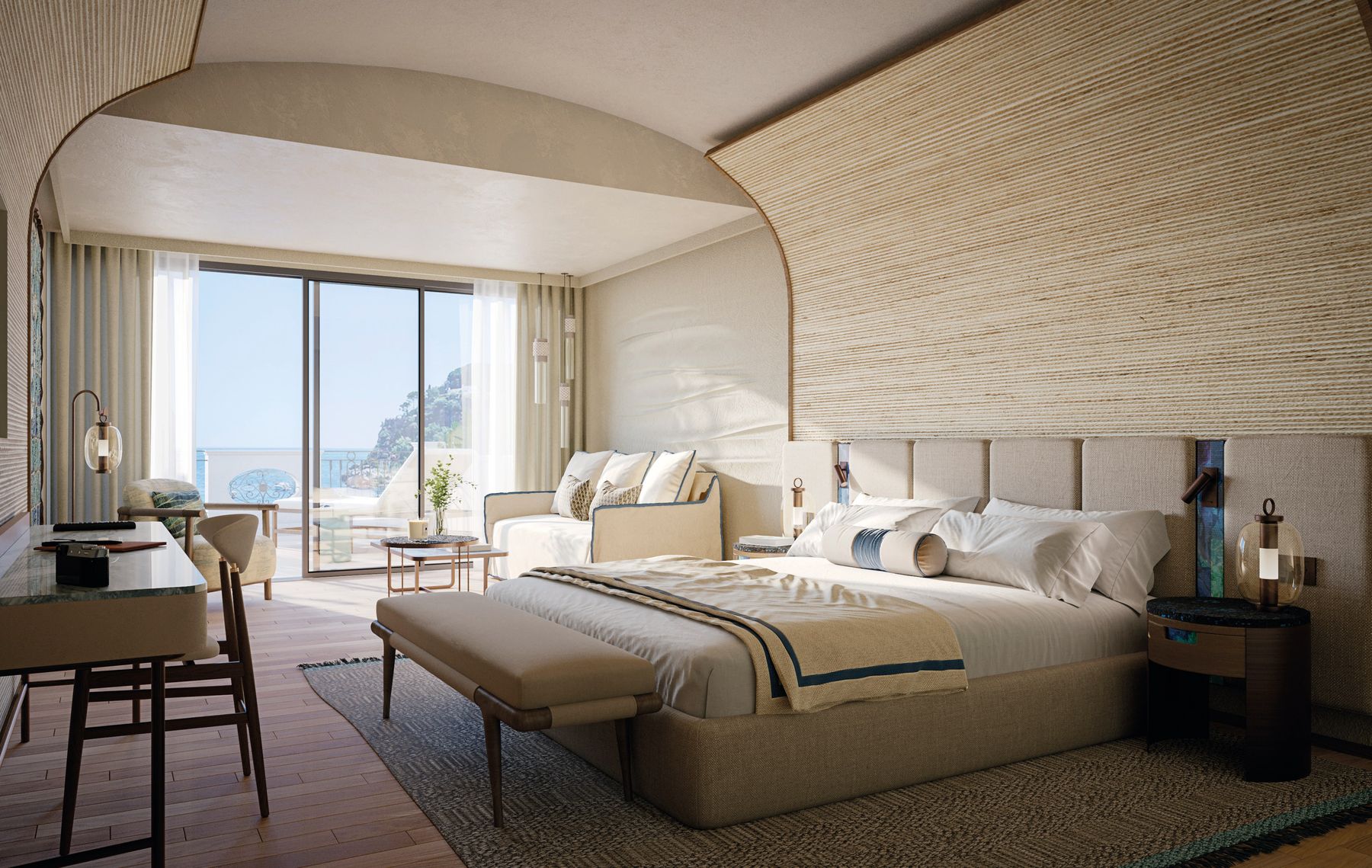 Hotel guestroom with bespoke upholstered headboard wall, desk and sea-view window