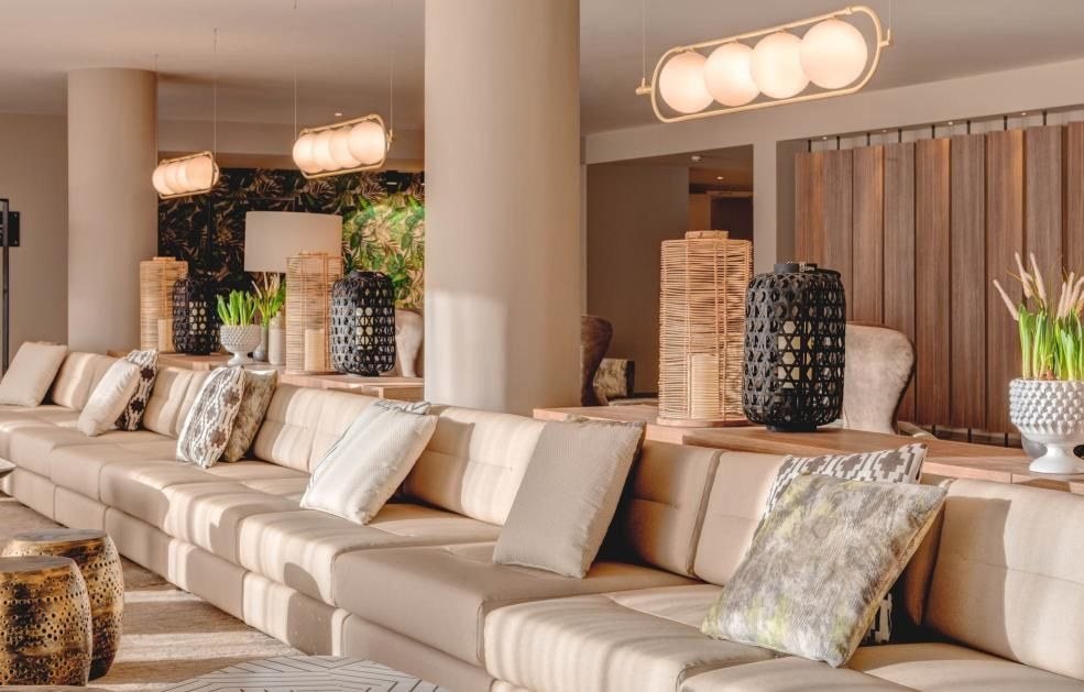 Lounge with long banquette and warm timber